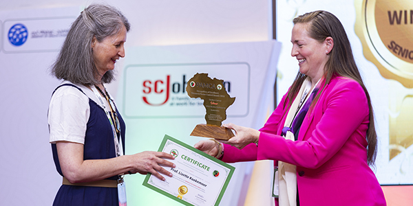 Wits Prof. Lizette Koekemoer LEFT receives the PAMCA Women in Vector Control Award from Dr Helen Jamet of BMGF 600x300 Wits Prof. Lizette Koekemoer LEFT receives the PAMCA Women in Vector Control Award from Dr Helen Jamet of BMGF 600x300